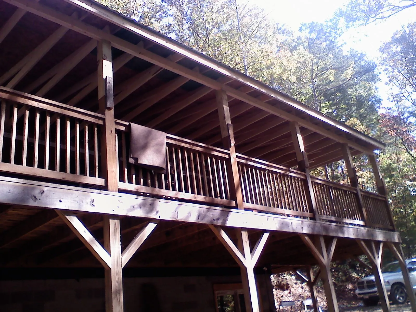 Timber framing under a new elevated porch and deck — Roof Leak Repair in Blissfield by Roofing Brothers